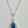 Black Crystal Opal Pendant with Diamond Surround - hanging